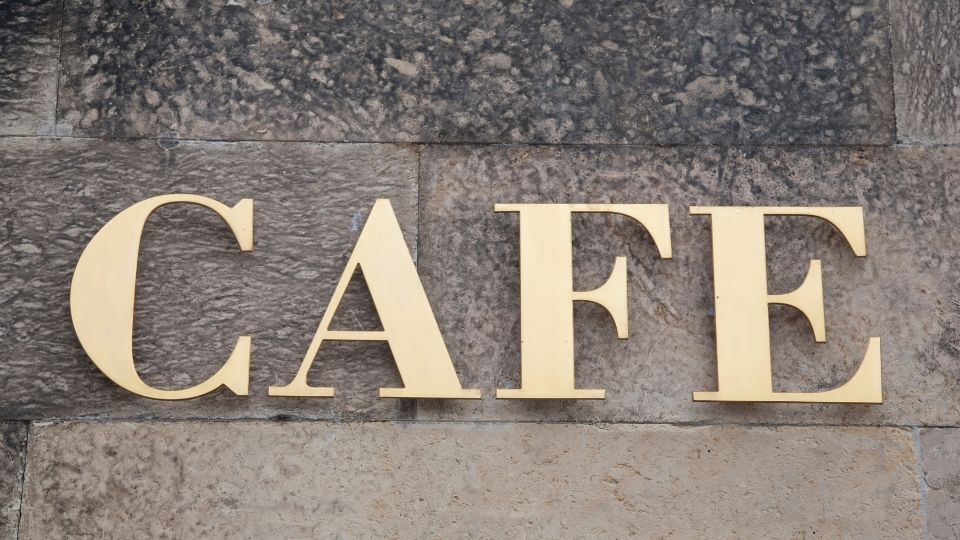 (An acrylic wall sign can be seen for a cafe in the image)
