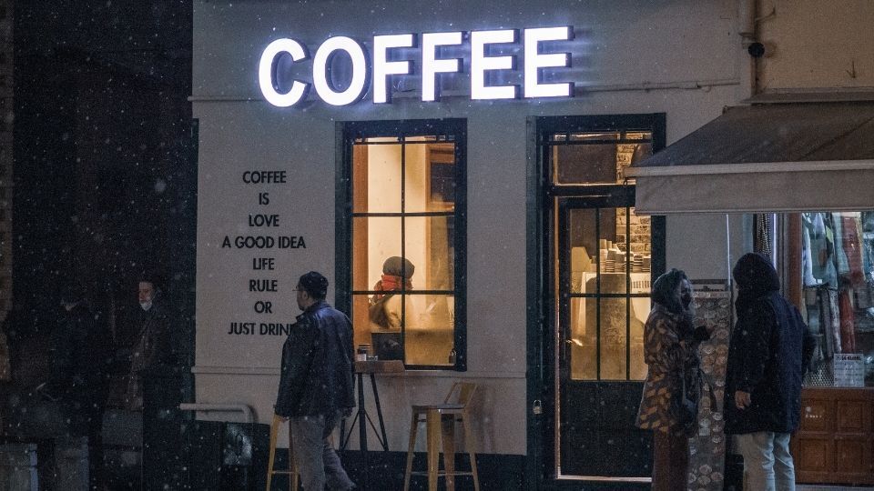 (In the the image a fascia sign can be seen outside a coffee shop)