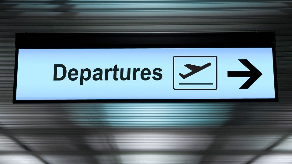 (In the image a backlit logo sign can be seen at the airport)