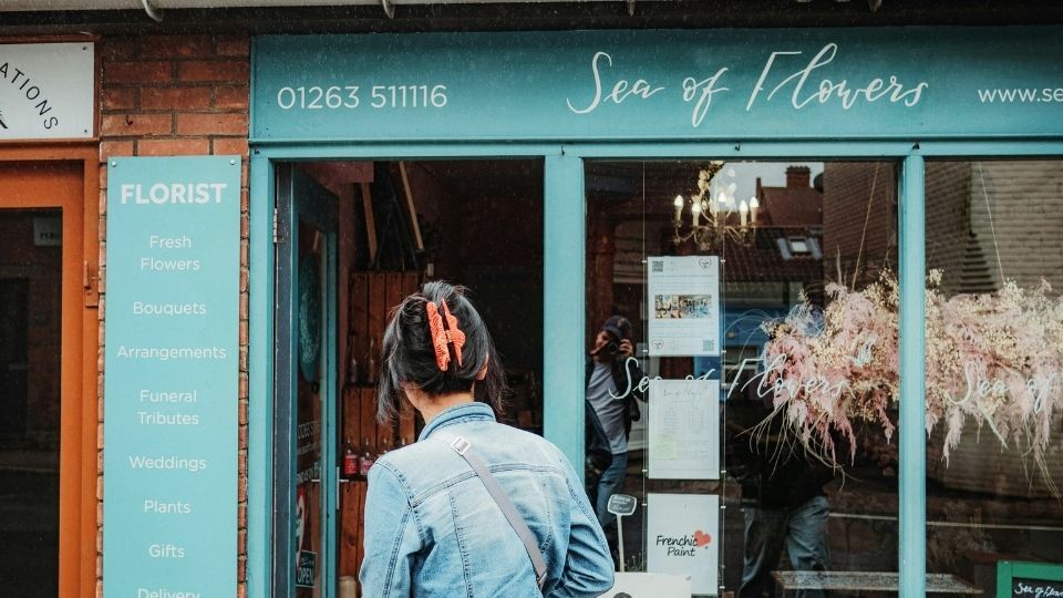 (In the image an innovative shop front design can be seen for a flower shop)