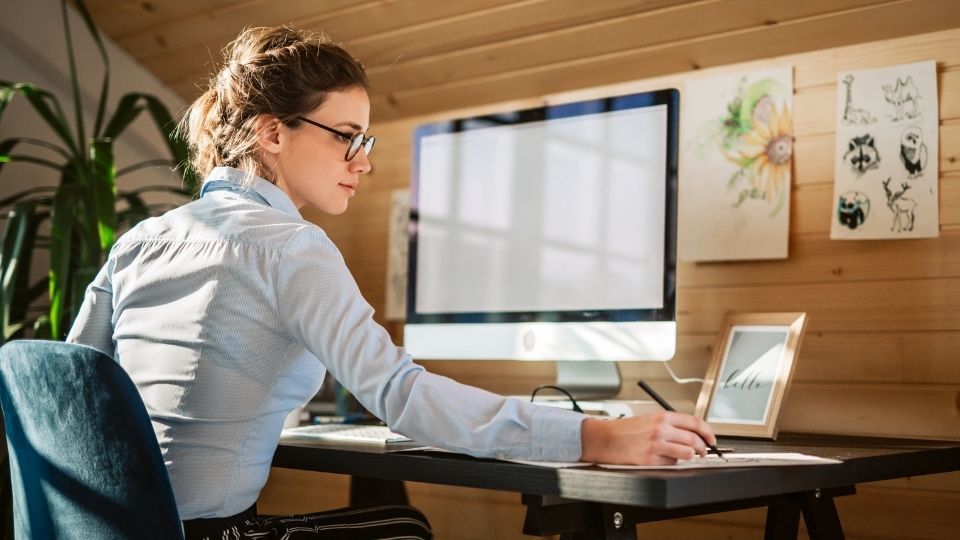 (In this picture a designer can be seen performing maintenance to ensure longevity of wall graphics design)