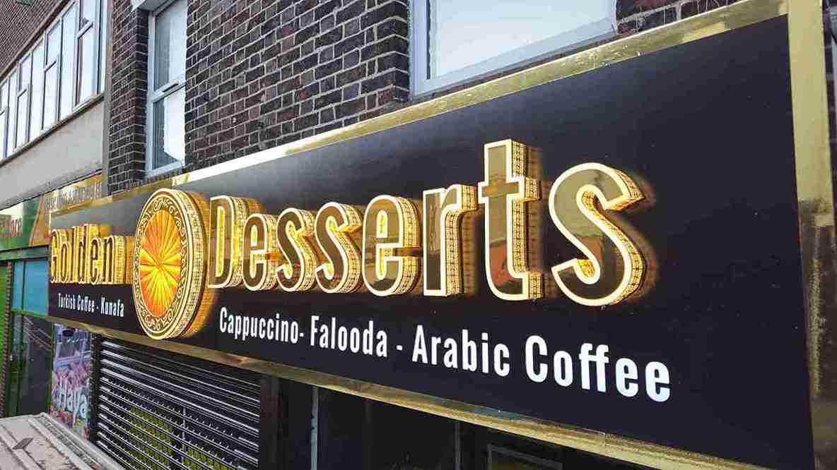 Illuminated shopfront fascia sign for a desserts and coffee business, showcasing outdoor business signs by Manchester Signs Centre